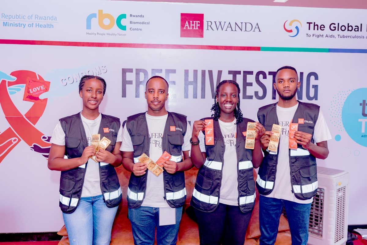 AHF Rwanda - Staff offering free condoms at an event